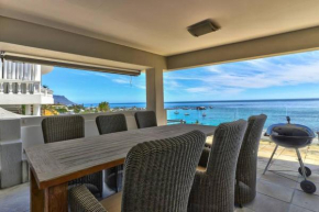Family living on Clifton Beach front